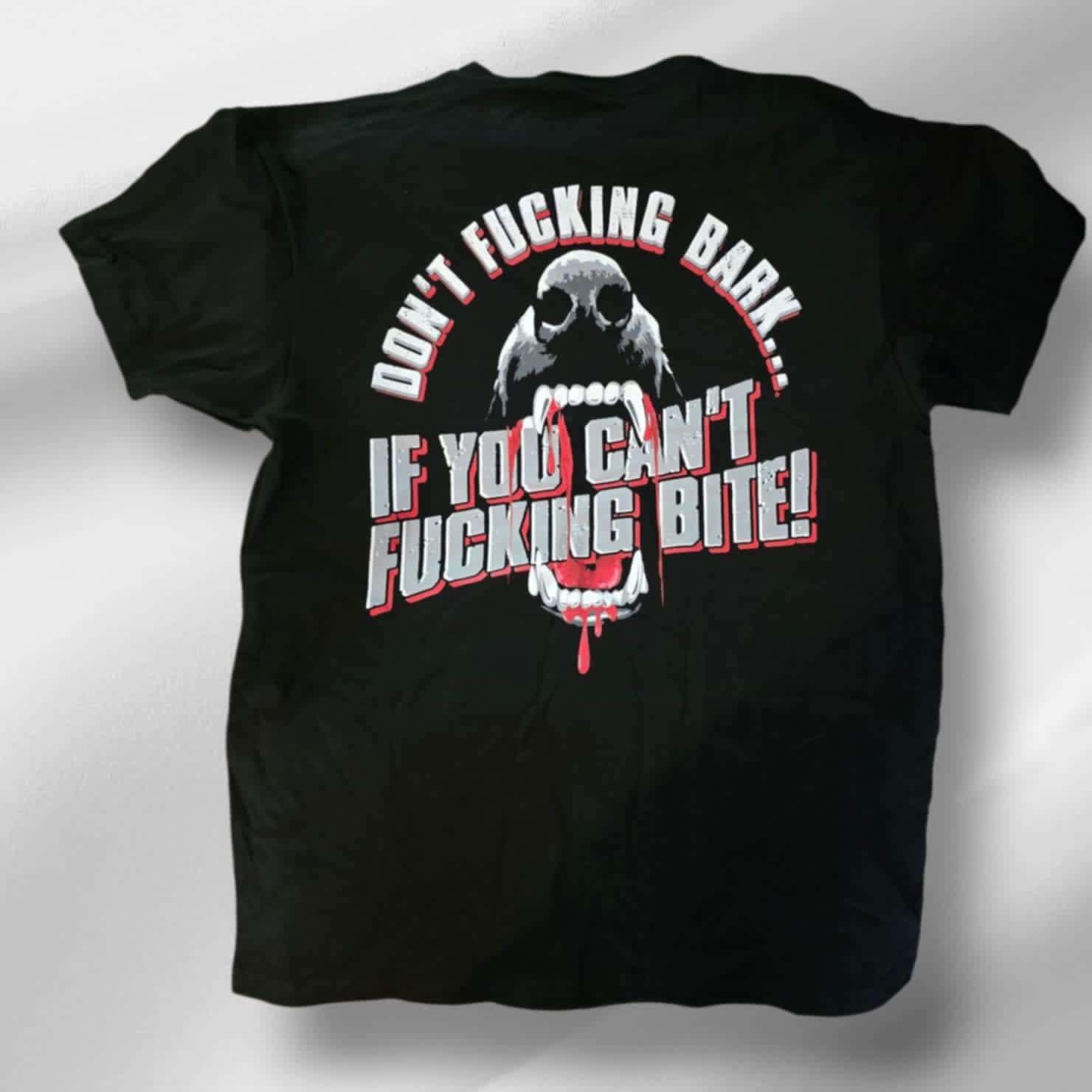 Sick Bastard Streetwear graphic T-shirt with bold "Don't Bark If You Can't Bite" message and snarling beast design.