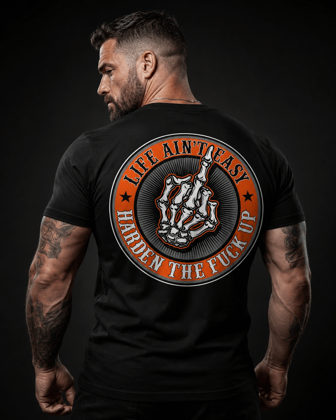 Model wearing black tee with 'Life Ain't Easy, Harden the Fuck Up' design, representing motivational quotes for tough times.