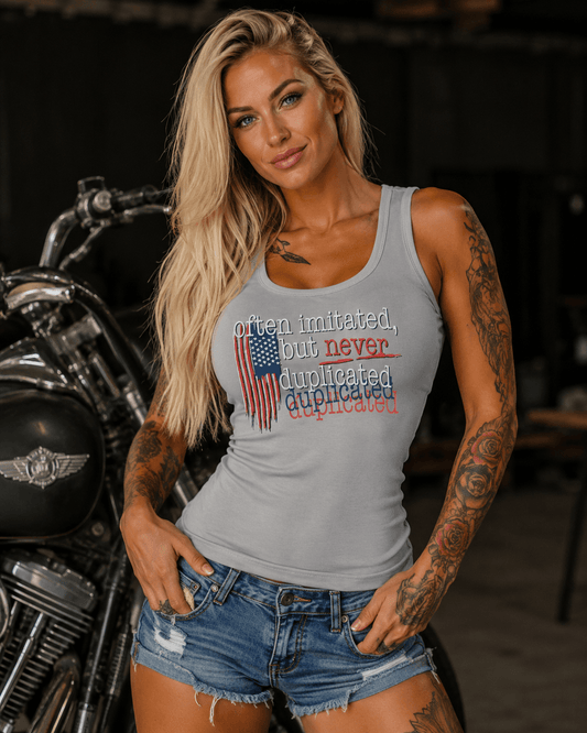 Woman wearing Often Imitated Never Duplicated backless tank top with distressed American flag graphic and open back design