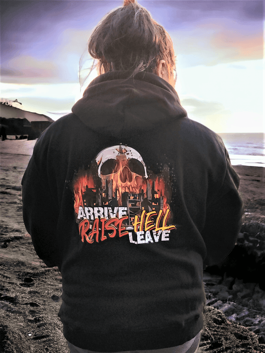 Back view of a person wearing the Arrive Raise Hell Leave Hoodie featuring a skull design with fiery graphics.