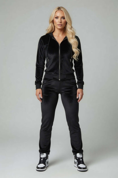 Black velour track suit jacket with hoodie and sparkling rhinestones on back, oversized hood, and silver zipper.