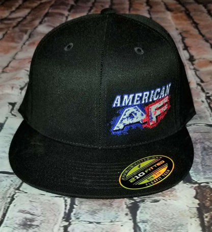 American flag flexfit hat featuring an embroidered American AF logo on a black flat bill design.