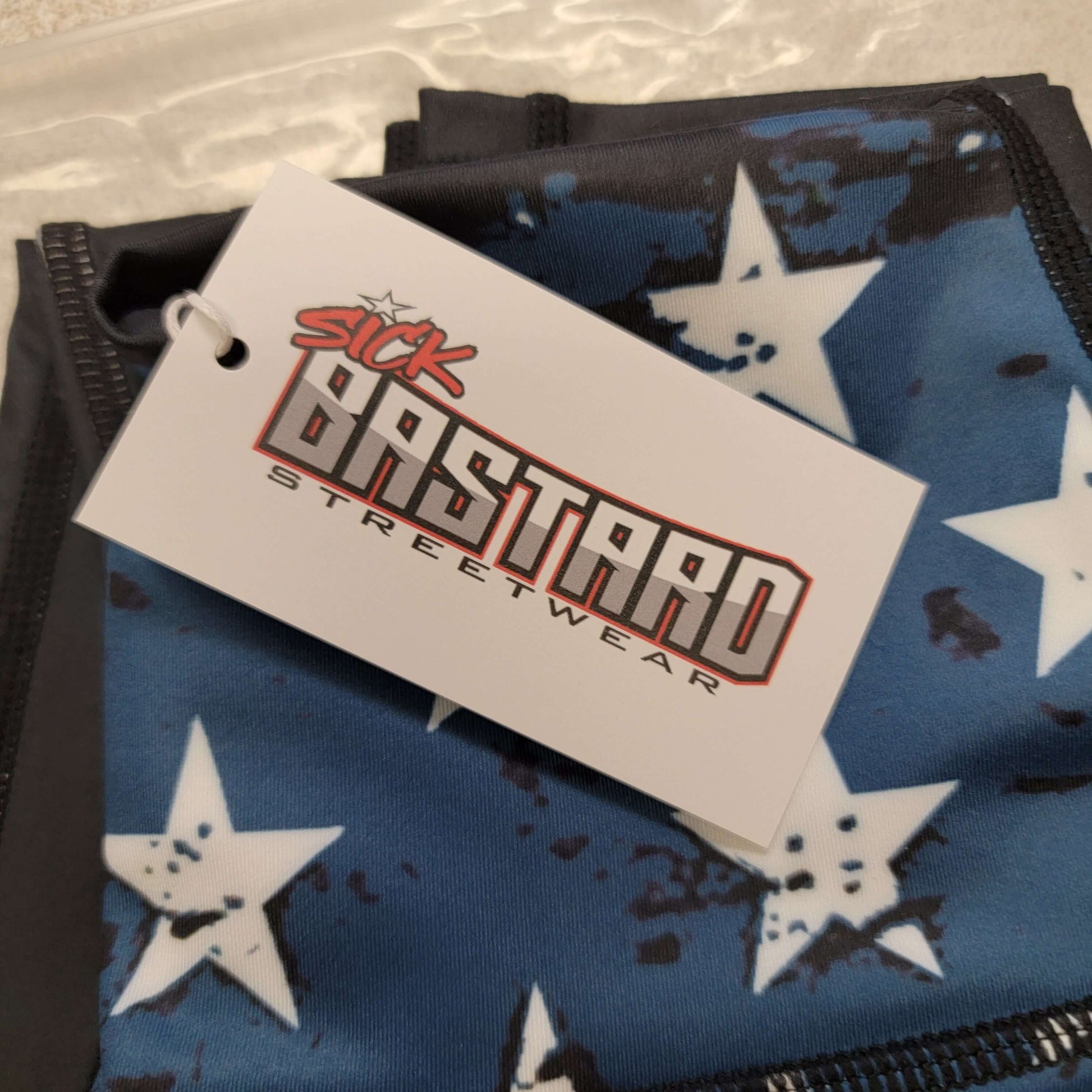 Sick Bastard Streetwear tag on American AF leggings featuring blue and white stars, representing patriotic leggings.