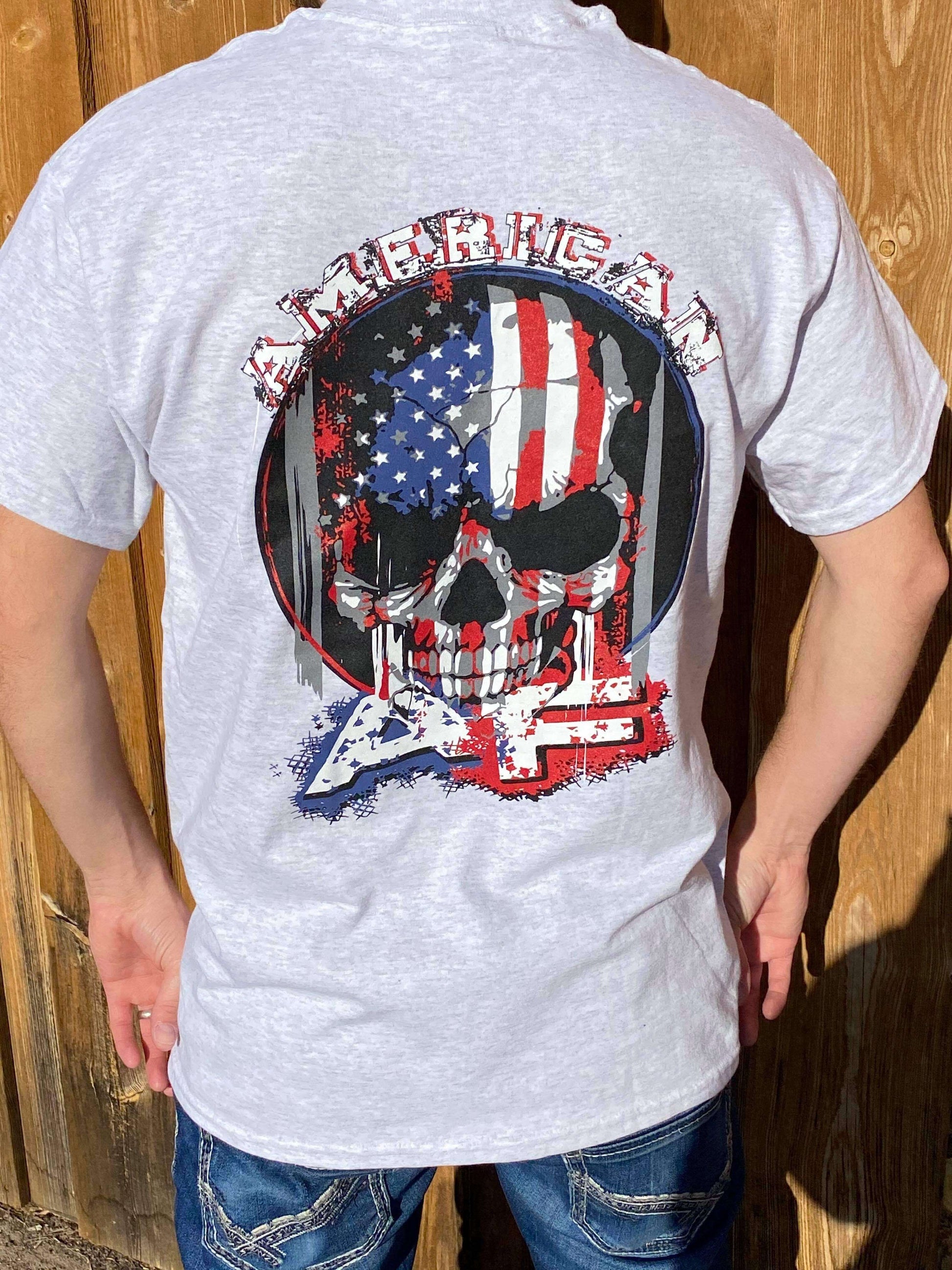 Back view of a person wearing an American AF T-shirt with a bold skull and American flag design.