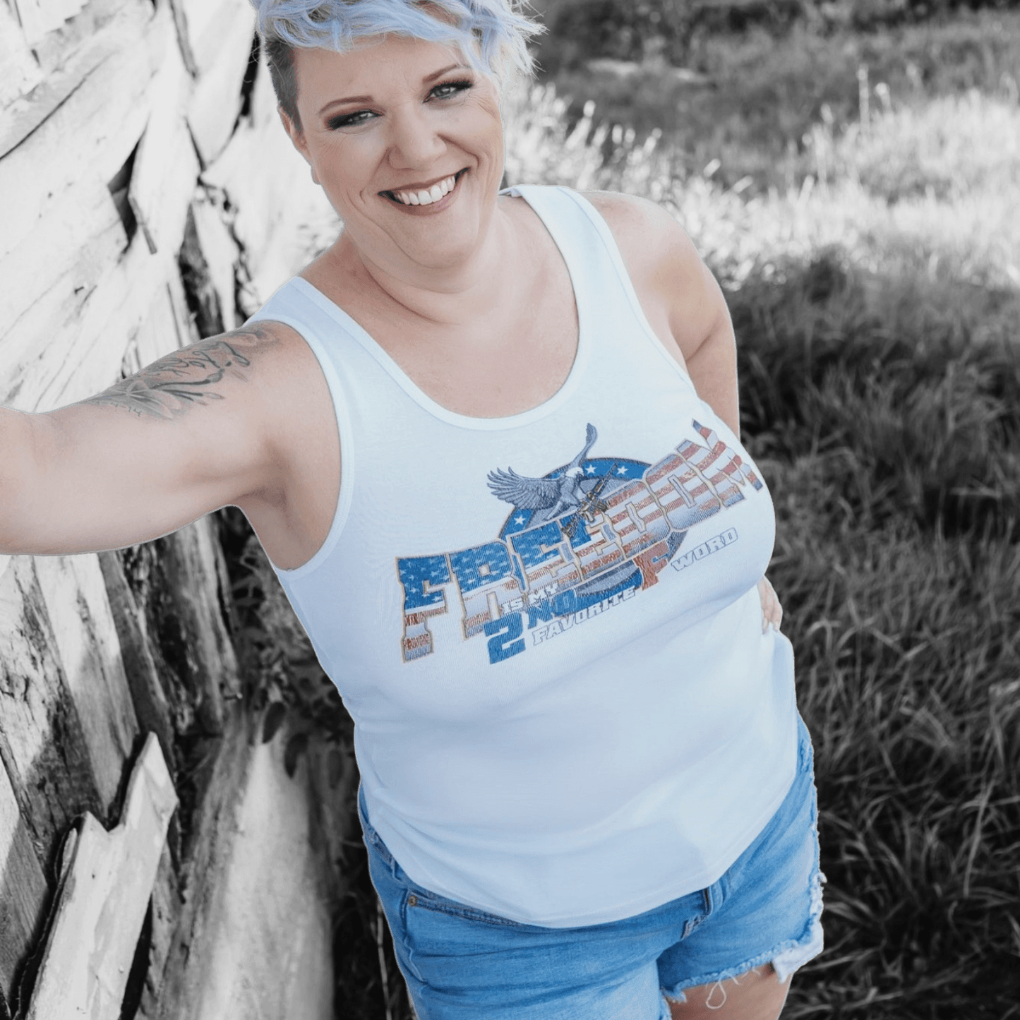 Woman wearing a Freedom Tank Top for Women, expressing bold and free-spirited style.