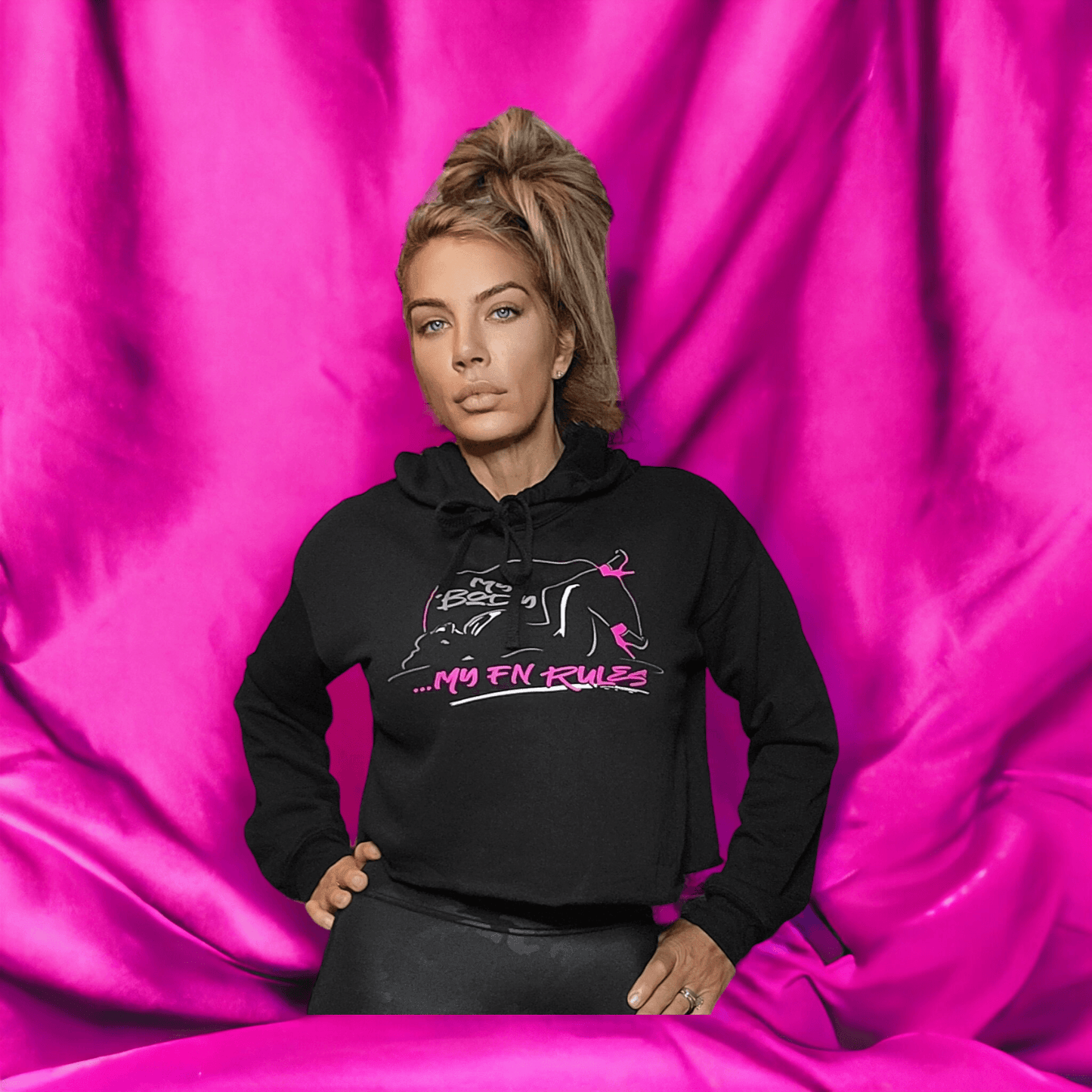 My Body My FN Rules Ladies Cropped Fleece Hoodie worn by a model, showcasing women's cropped fleece hoodie against a pink backdrop.