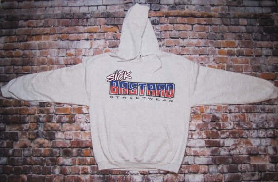 Sick American Bastard Hoodie Pullover displayed on a brick background featuring bold logo graphics.