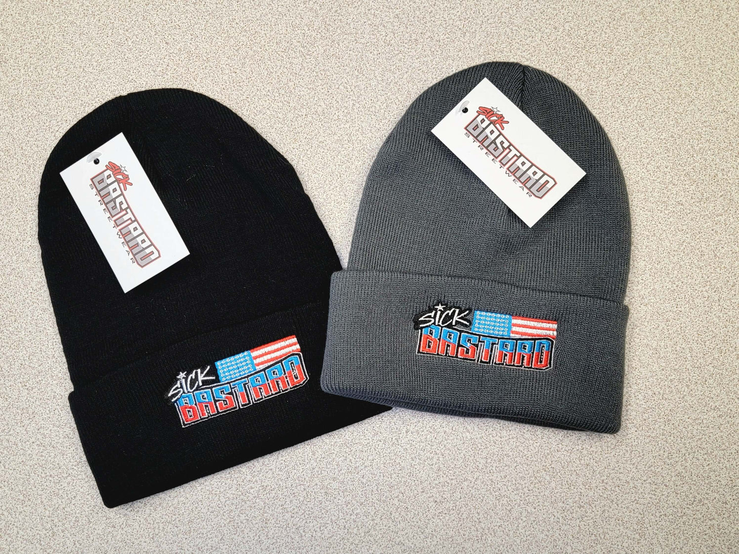 Sick Bastard Flag Beanie collection in black and gray showcasing bold streetwear logo design.