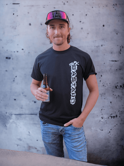 Man wearing a funny graphic t-shirt from Sick Bastard Streetwear, holding a beer against a textured background.