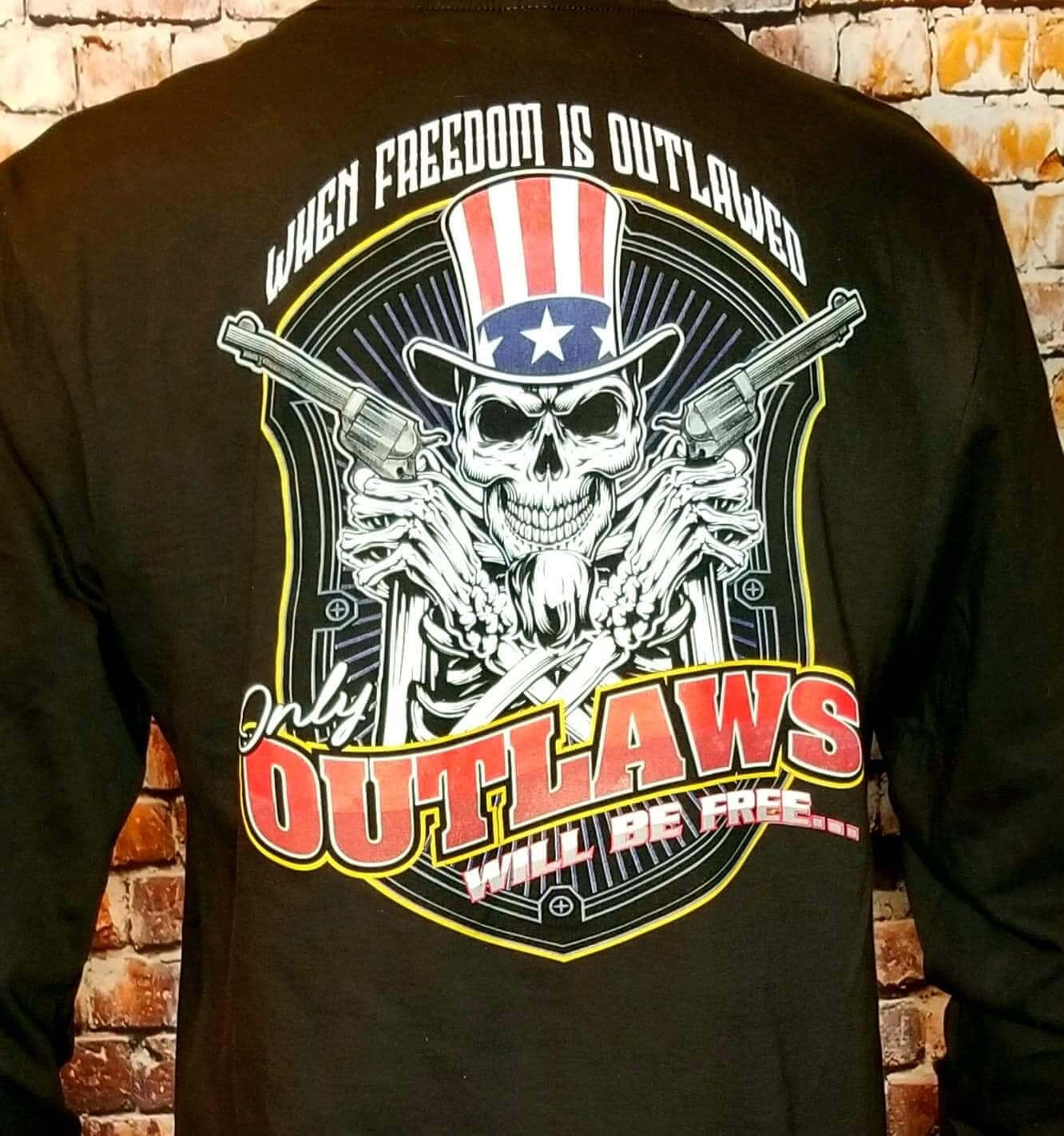 Freedom long sleeve shirt featuring a skull and guns with the quote "When Freedom is Outlawed Only Outlaws Will Be Free".
